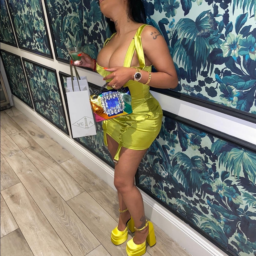 This is is an absolute must have! Worn only once to lunch. Lime green yellowish.